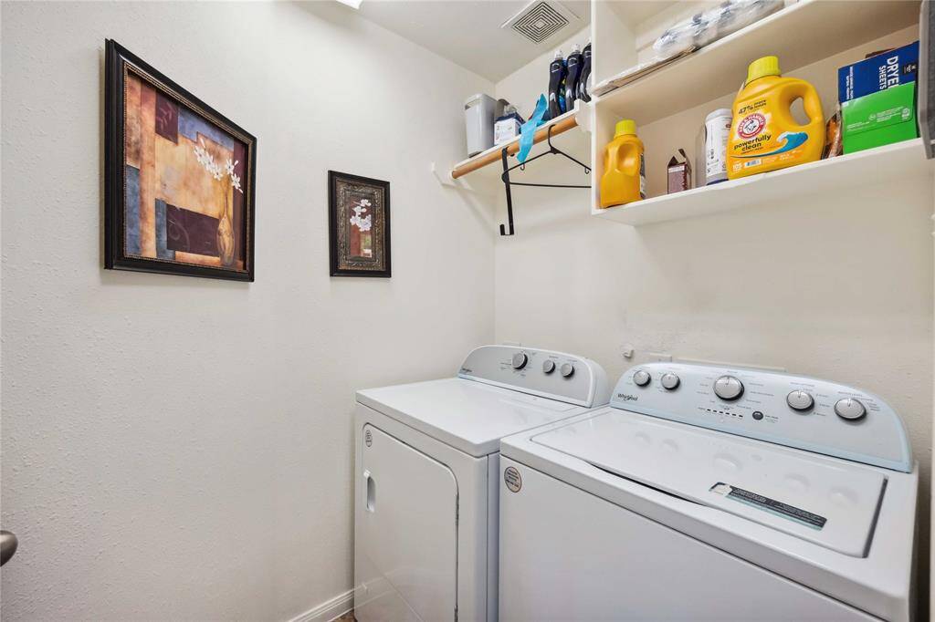 Utility room located by the 2 car garage