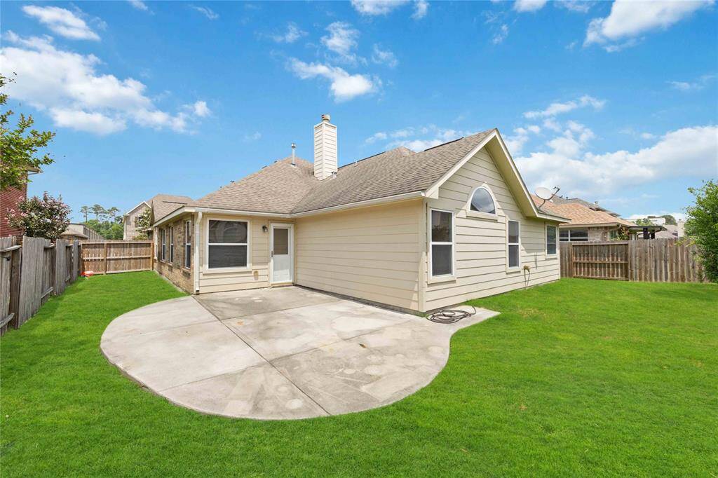 Backyard with ample space for entertaining and BBQs.