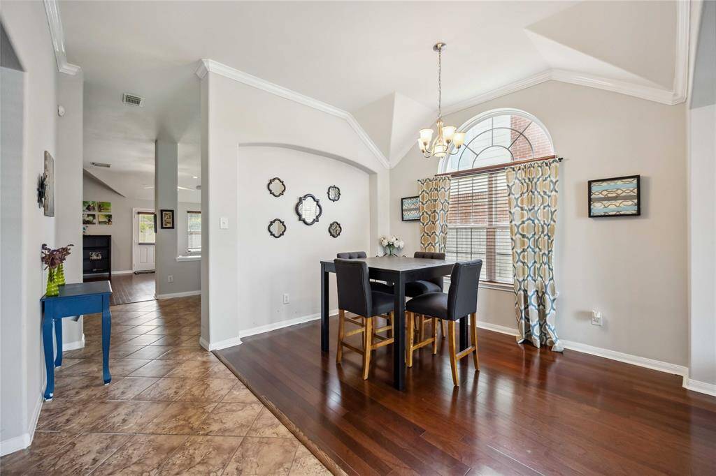 Formal dining room with wood flooring, located just off the fornal living room—ideal for gatherings.