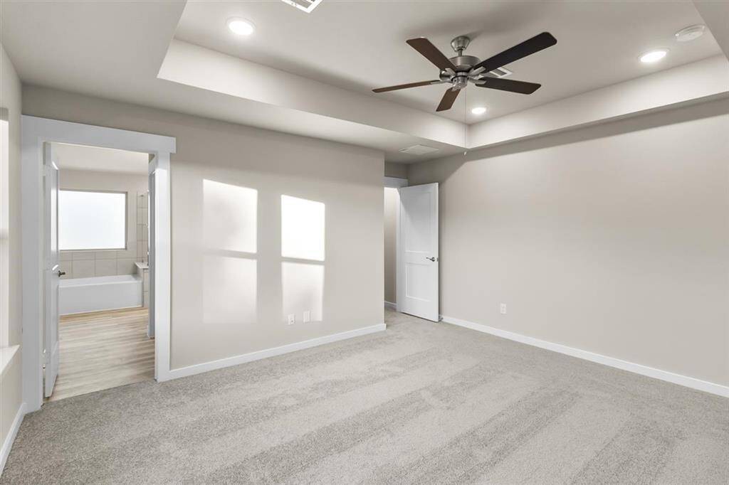 The spacious layout offers plenty of room for a plush king-sized bed, adorned with fluffy pillows and your favorite throws, inviting you to sink in and relax.