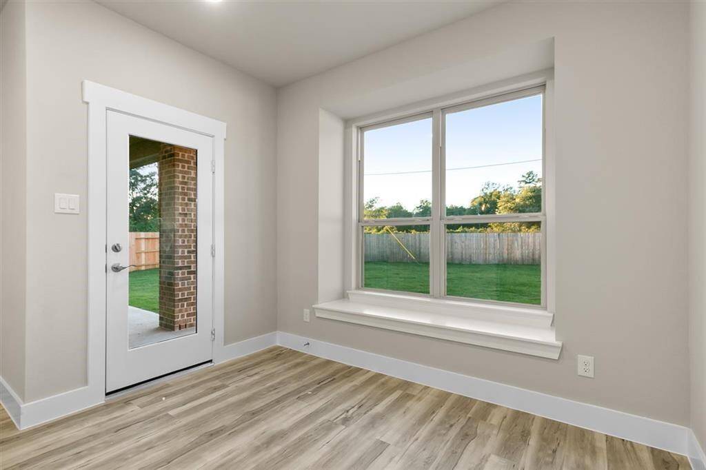 You'll love how the open layout seamlessly connects to the kitchen, making it easy to serve up your favorite dishes while still being part of the conversation.