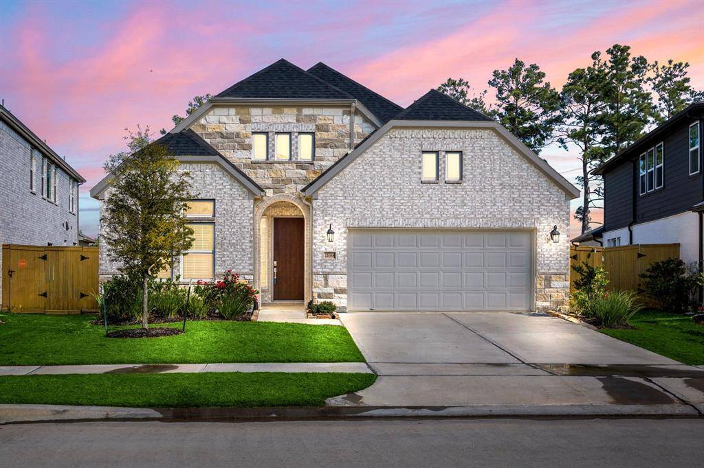 Welcome home to 22038 Big Sky Dr. located on a street in Raburn Reserve and zoned to Tomball ISD! This stunning home has lovely curb appeal, a well-manicured lawn, beautiful landscaping, stone/brick elevation, dark stained front door, covered front porch, traditional style, beautiful outdoor lanterns and a double wide driveway!