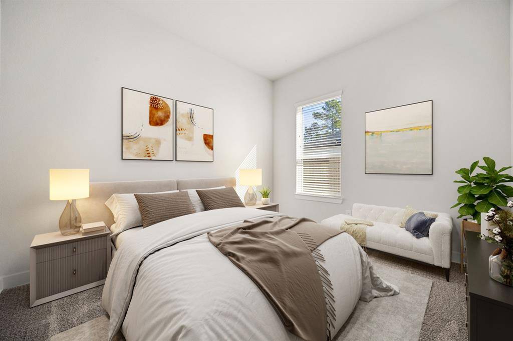 Secondary bedroom features plush carpet, custom paint, and a large window that provides plenty of natural light. *Virtually Staged
