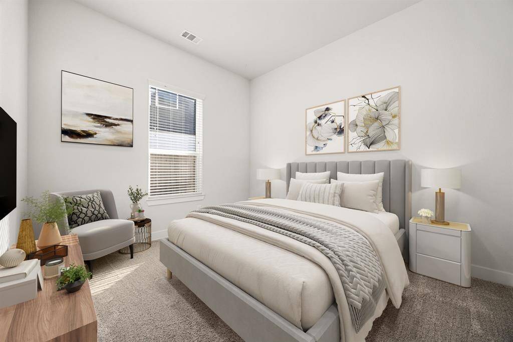Bright and comfortable, this secondary bedroom features ample closet space and a large window, creating a cozy retreat for family or guests. *Virtually Staged