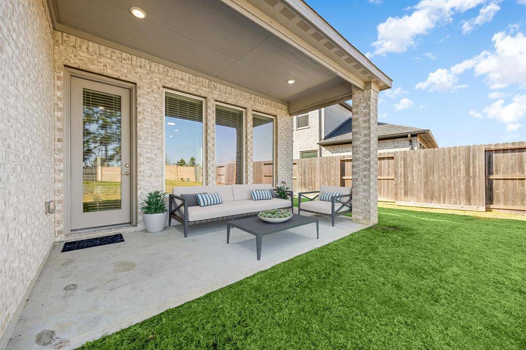Come and see this spacious backyard with its beautiful covered patio. There is plenty of room for the kids to play and adults to relax! Perfect for your outdoor living space, patio furniture, bbq pit, and so much more. The possibilities are endless!