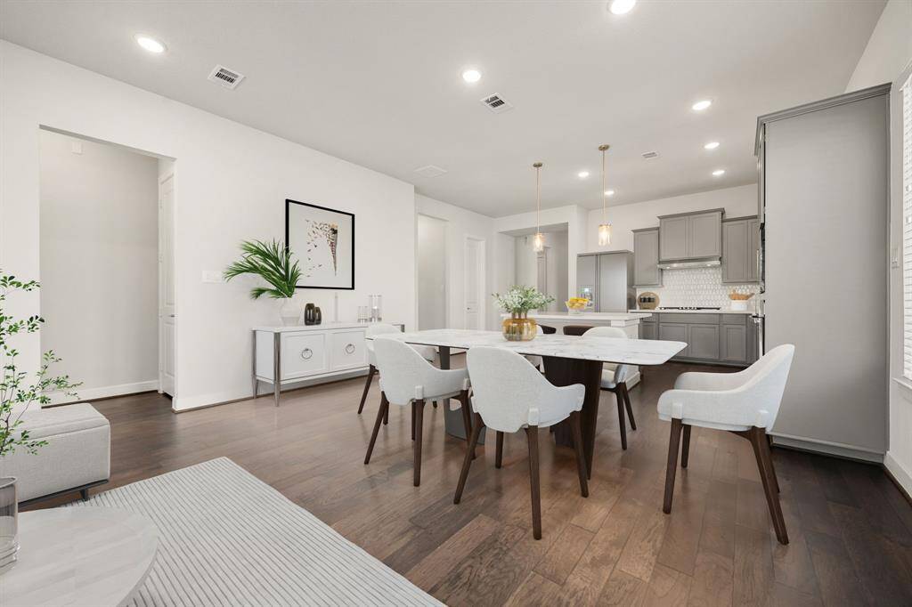 Enjoy meals in this warm, welcoming dining room, offering an abundance of natural light and seamless flow from the kitchen—perfect for family gatherings or formal entertaining. *Virtually Staged