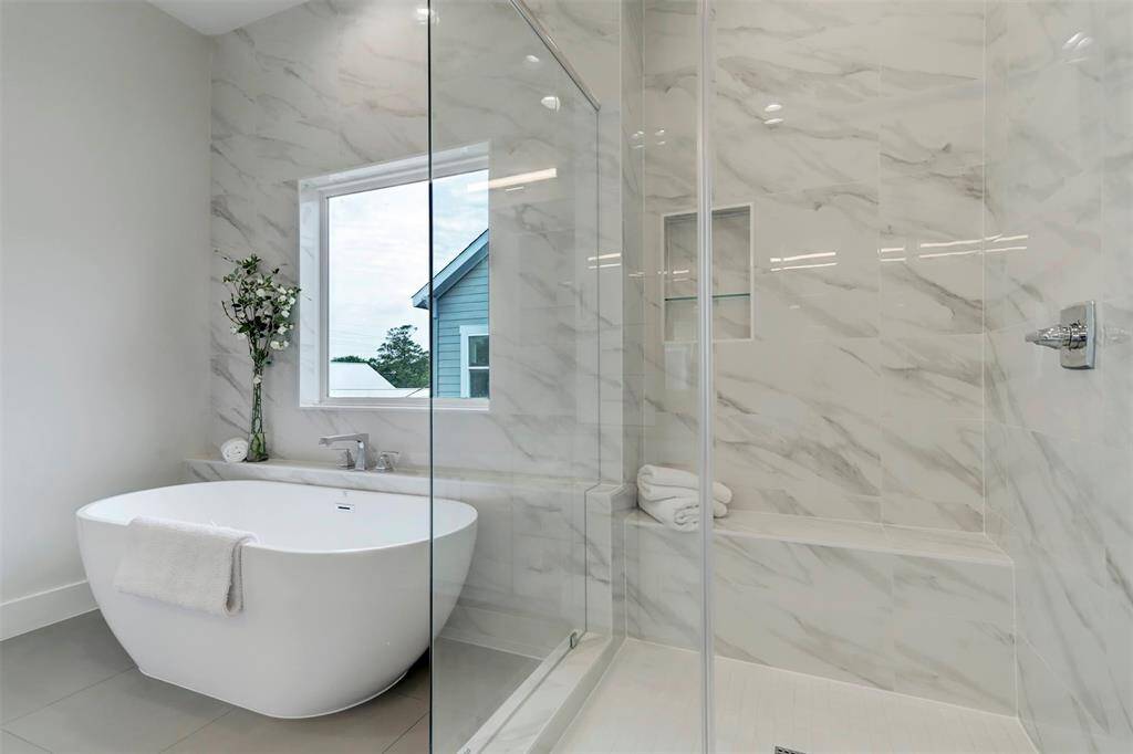 Primary en-suite bathroom with soak in tub and seprate walk-in shower