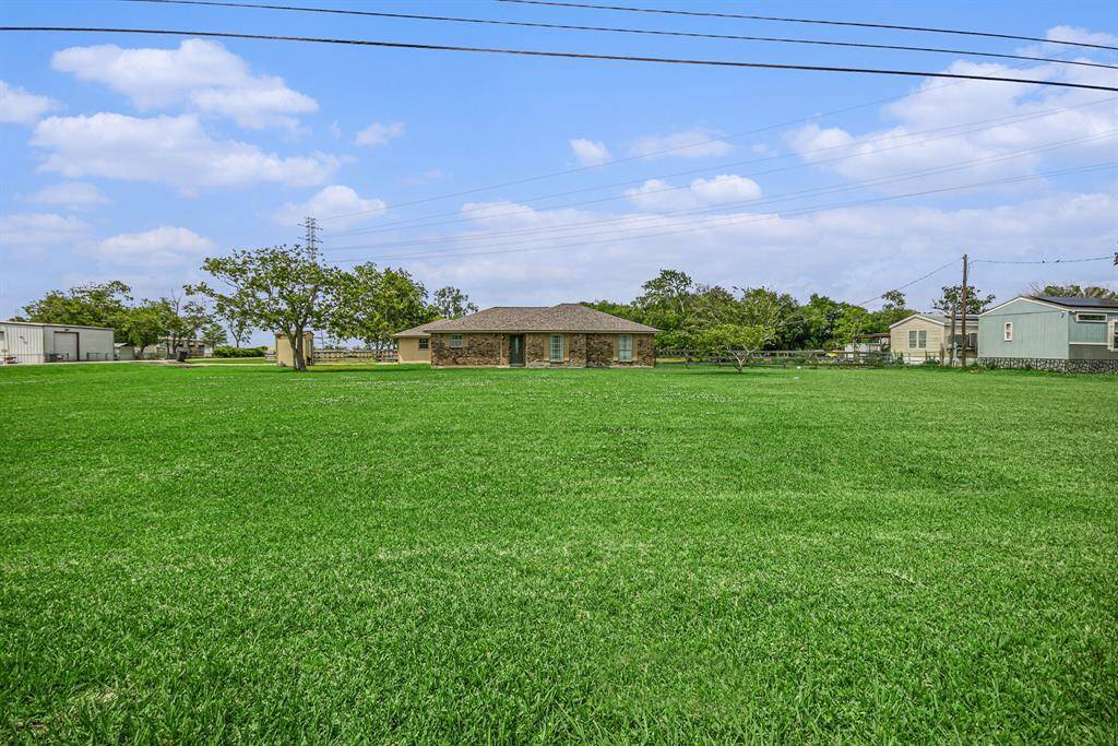 This expansive front yard is big enough to add a circle driveway.  How would you design this space?