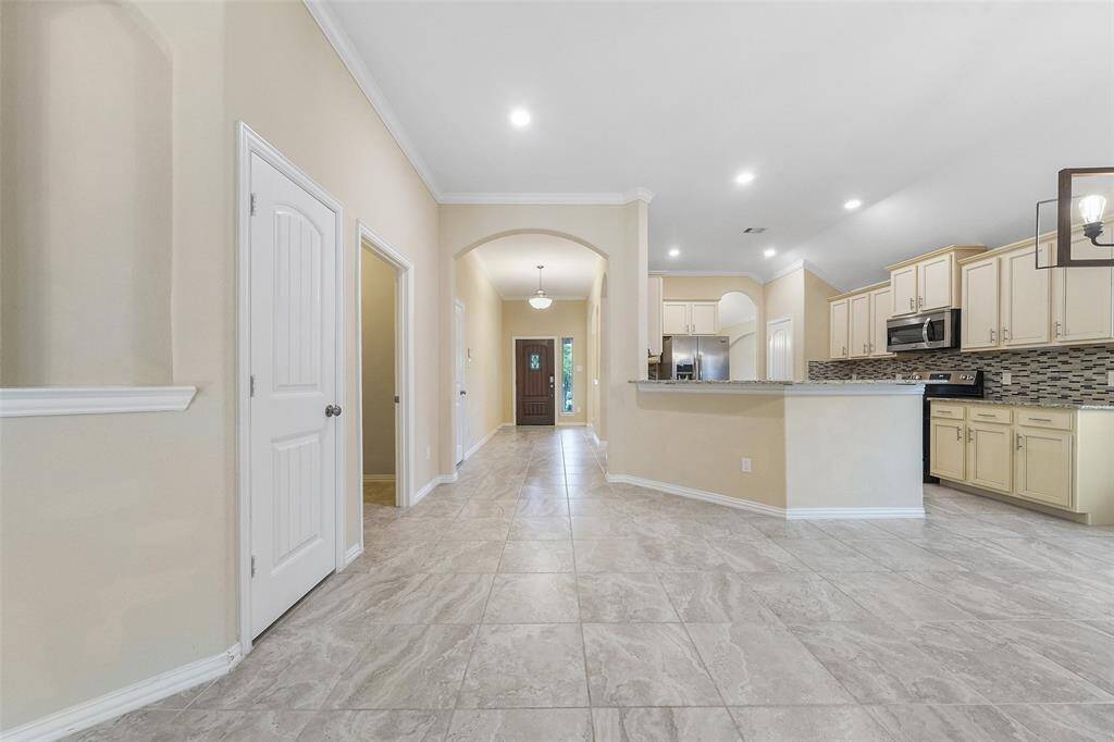 Additional art nook and view of the kitchen and entry way.