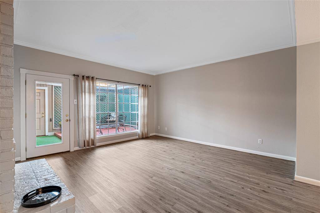living room with new flooring and view to private patio
