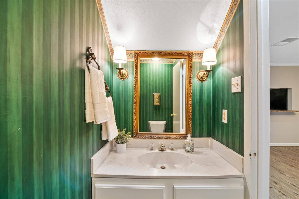 half bath with trending wall paper