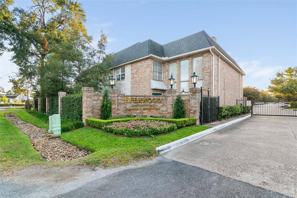 front view of gated Deerwood Condos