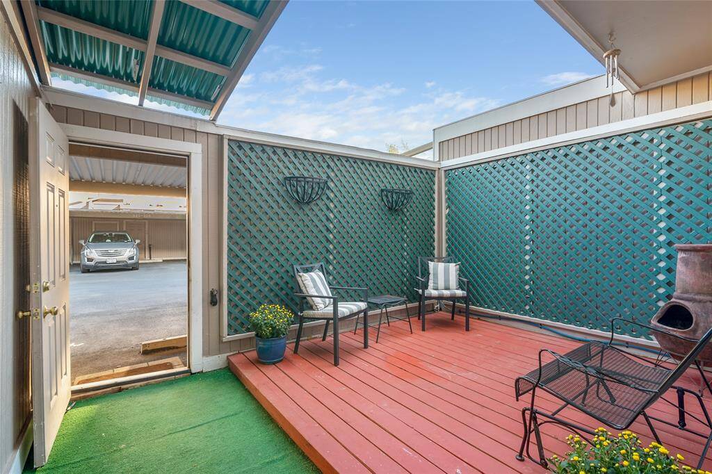view of back patio leading to parking