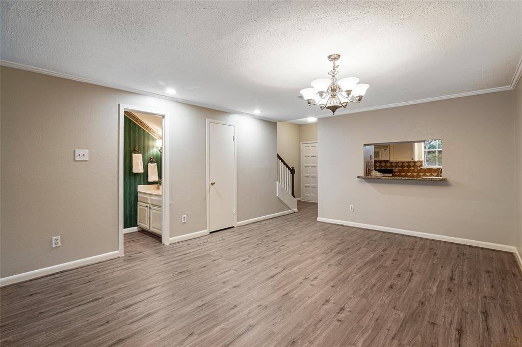 view of half bath and dining area. pass through from kitchen