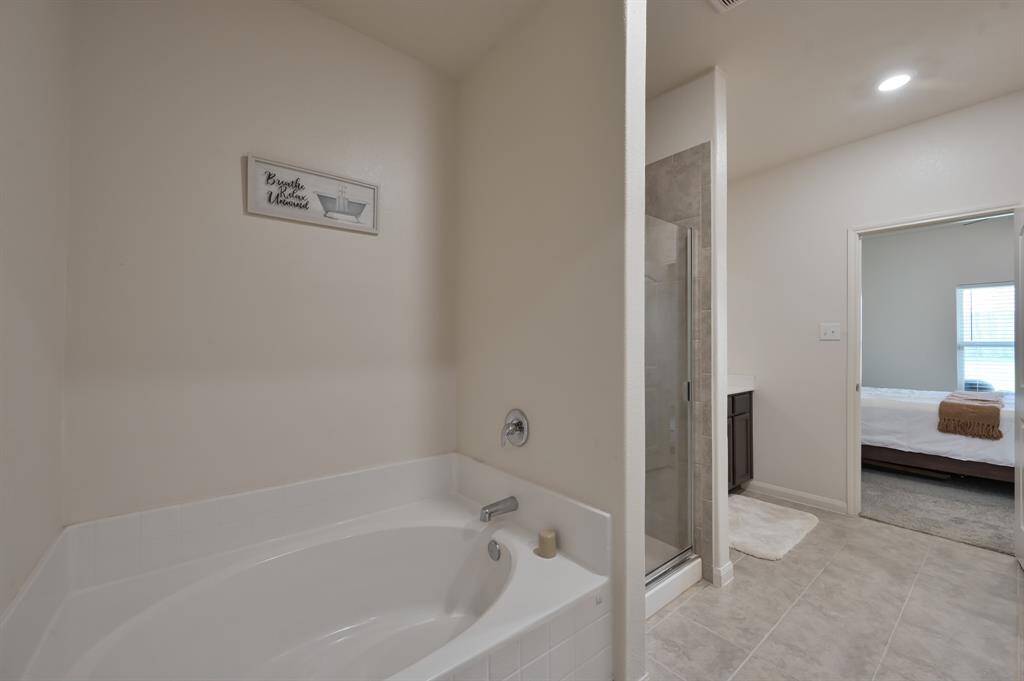 Primary Bathroom with Soaking tub and Shower in view