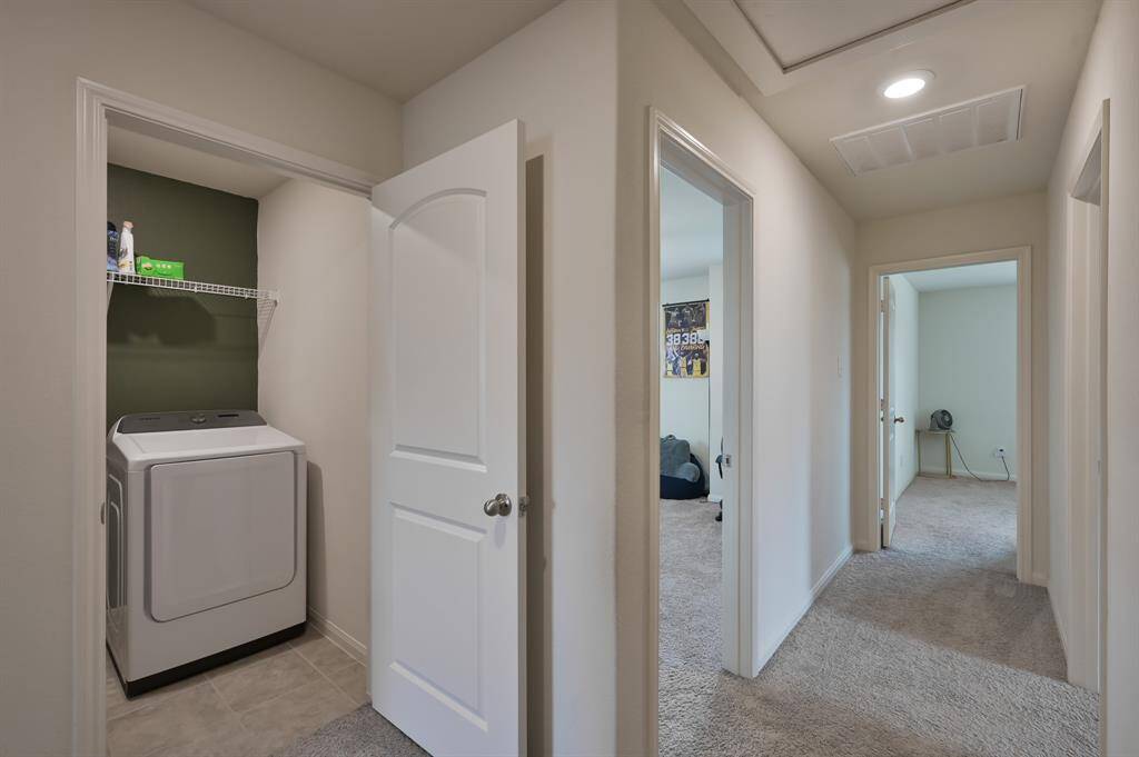 View of 2nd Floor Utility Room looking down the hallway to Bedroom 2, 3, and 4