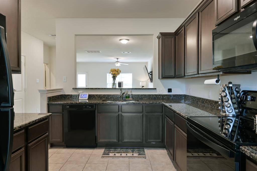 Kitchen View of sink, dishwasher and passthrough