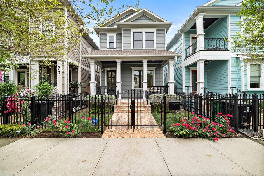 Welcome to 229 W 23rd! This charming Heights home (3 bed, 2.5 bath, 2,393 sqft) greets you with a warm, inviting entrance—sure to make you and your guests smile!