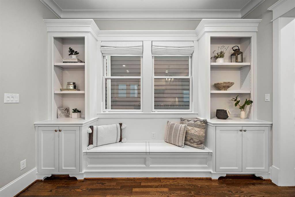 A close-up of the built-in shelves, cabinets, and bench seating with extra storage—an elegant and functional touch to this space!