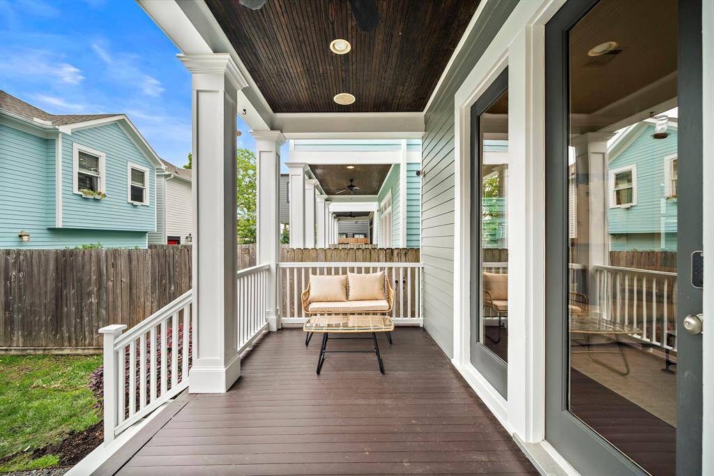 Spacious back porch, offering plenty of room to relax, entertain, or enjoy the outdoors in comfort.