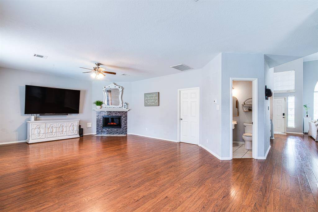 Large family room with access to downstairs powder-room