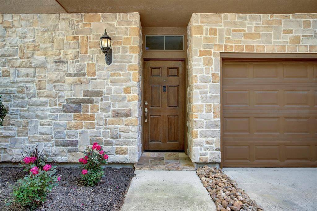 2 car attached garage with additional parking in driveway