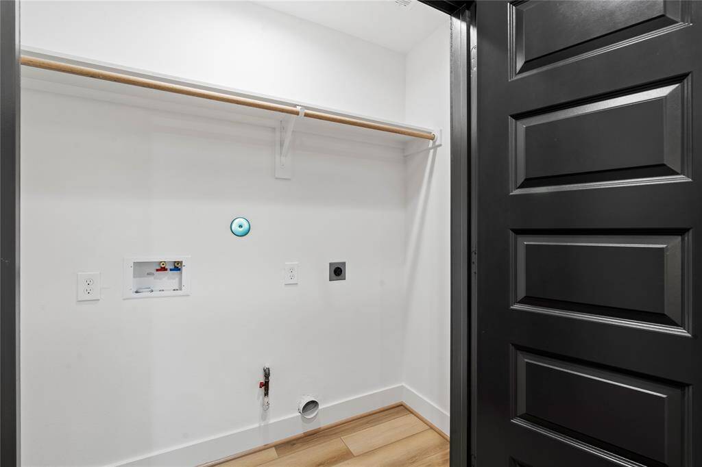 This convenient laundry room closet is equipped with connections for both washer and dryer, offering a practical and organized space to handle all your laundry needs with ease.