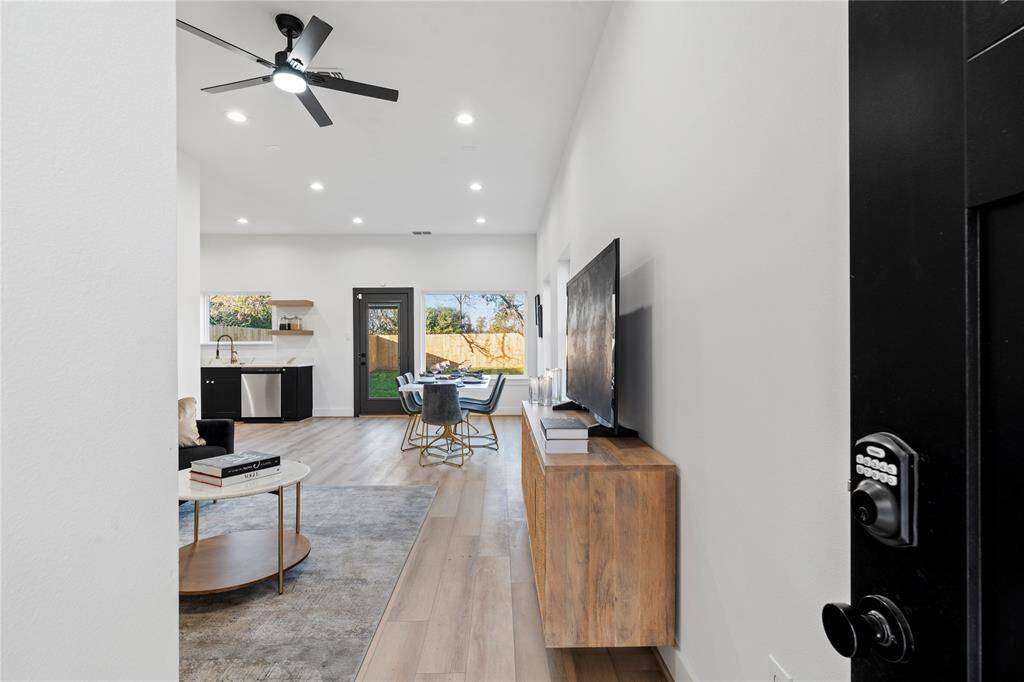 Upon entry, you'll be welcomed by a spacious living room that exudes warmth and charm, setting the perfect tone for both relaxation and entertaining.