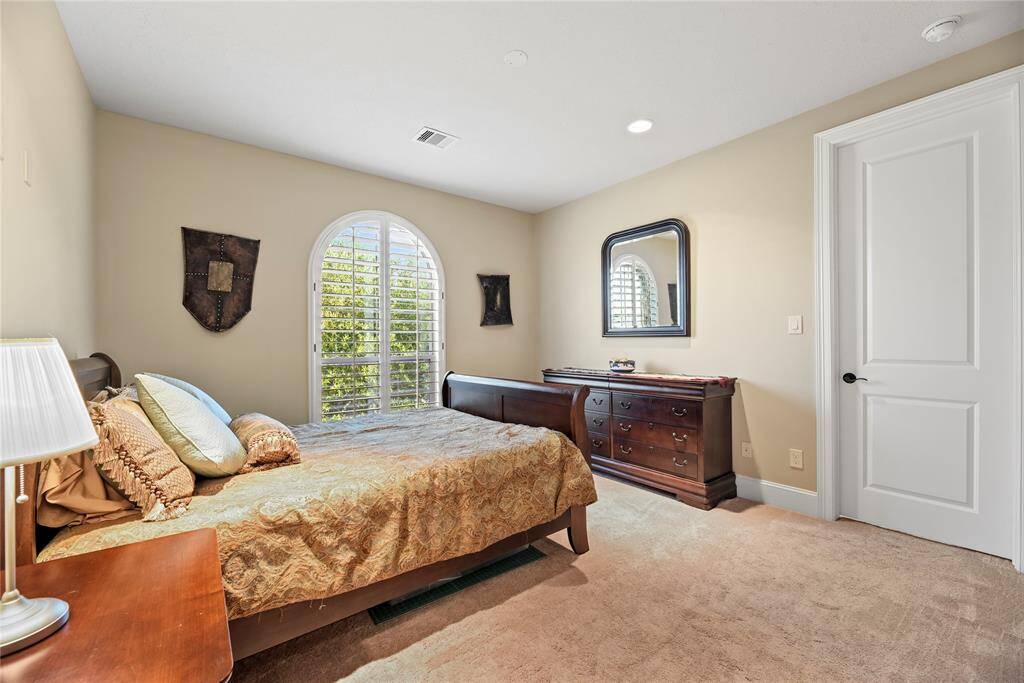 One of two upstairs secondary bedrooms with an en-suite bathroom.