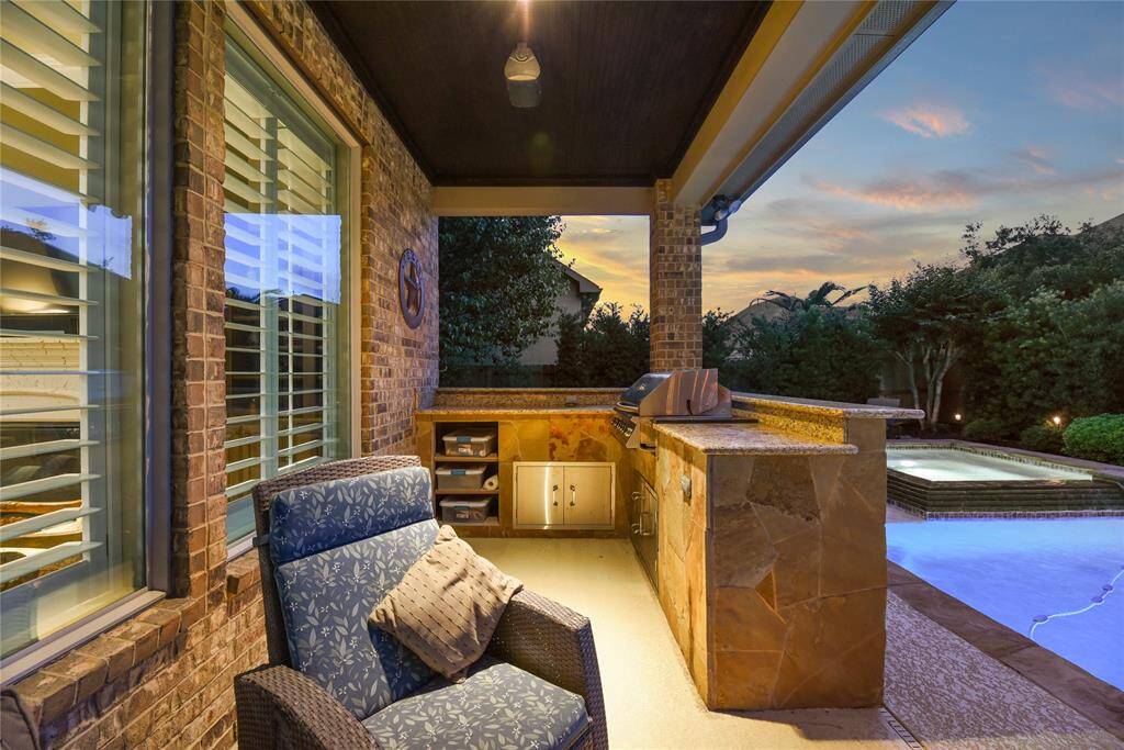 Covered patio with outdoor kitchen.