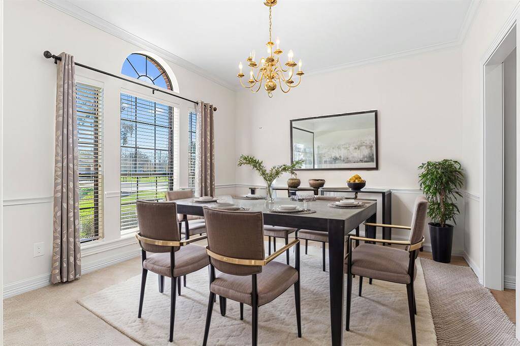 Formal dining room has been virtually staged to illustrate home's potential