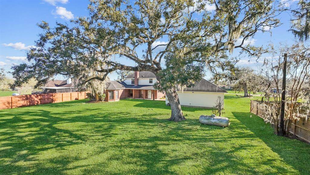 From the backyard, enjoy a stunning view of this impressive two-story home, complemented by the expansive three-car garage. The grand exterior offers a perfect blend of space and style, providing a beautiful backdrop for outdoor living and endless possibilities