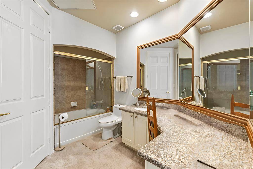The private primary bathroom offers plenty of room to move around.