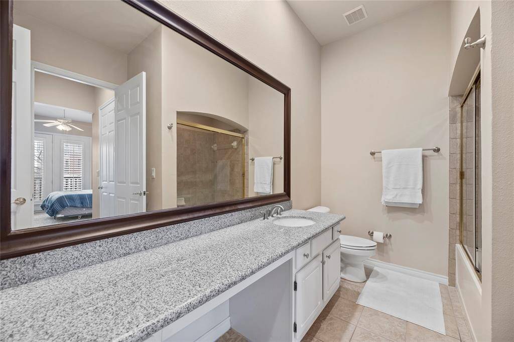 The 2nd bathroom offers a large vanity and access to the 2nd bedroom.