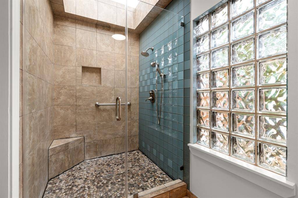 Large Walk-in Shower with hand rail and wide door