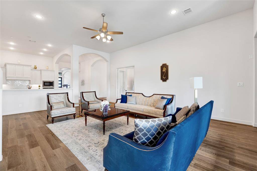 Another view of the living area facing the kitchen and the foyer area.