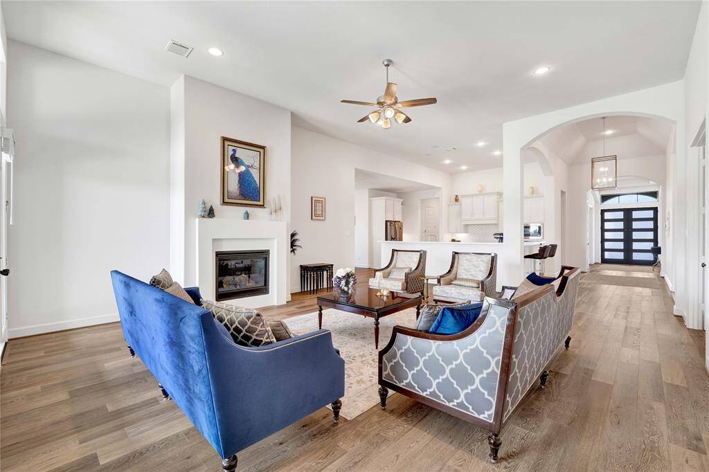 Another view of the living area facing the kitchen and the foyer area.