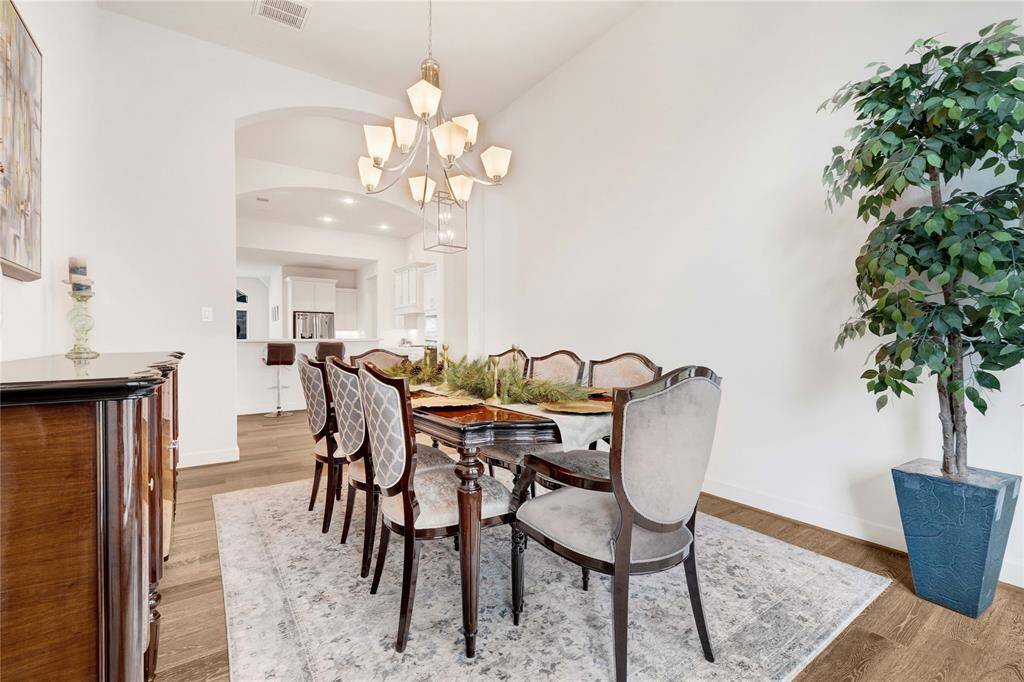 Specious dining room, with ample natural lighting.