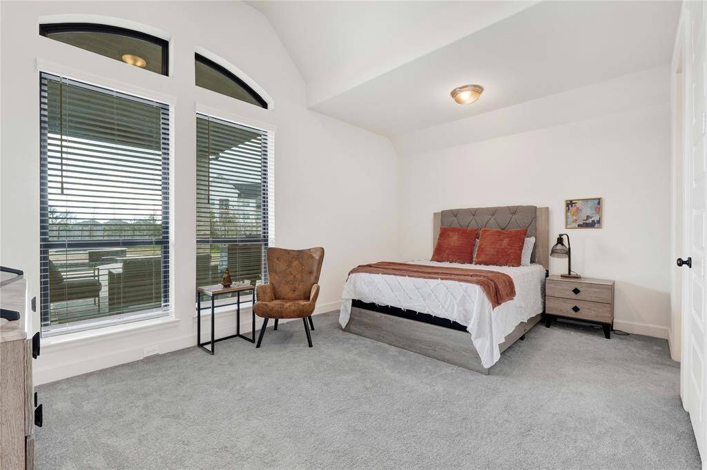 The second primary also has a view of the backyard patio and the pool.