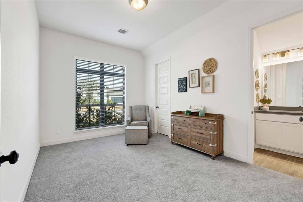 View of the bedroom with a window facing the front yard.