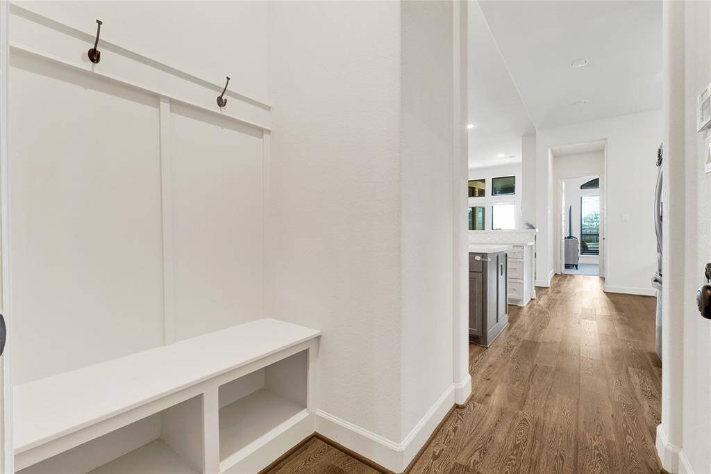 The mudroom connecting the garage space to the kitchen and main living area.