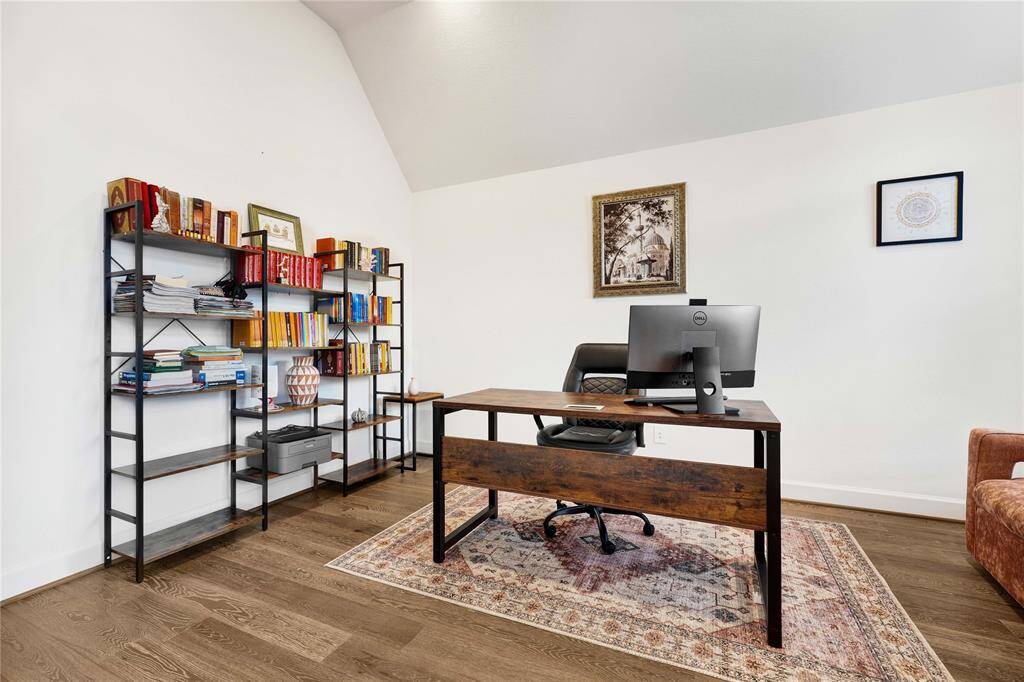 Large office space with high ceiling and ample natural light.