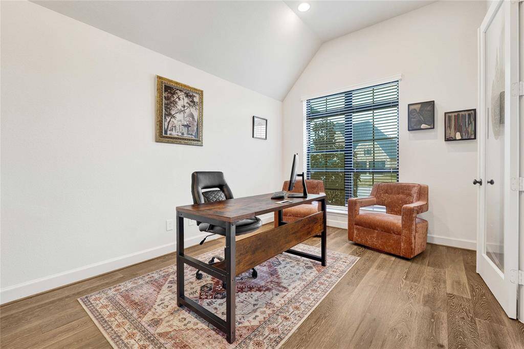Large office space with high ceiling and ample natural light.