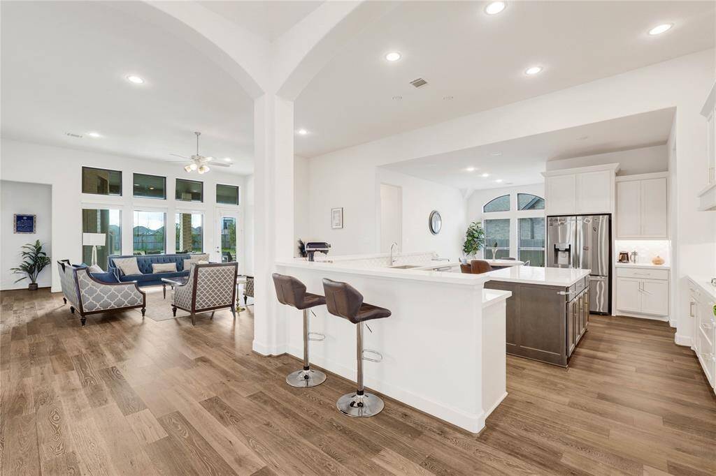 View of the gourmet kitchen right after the foyer area on your right side.