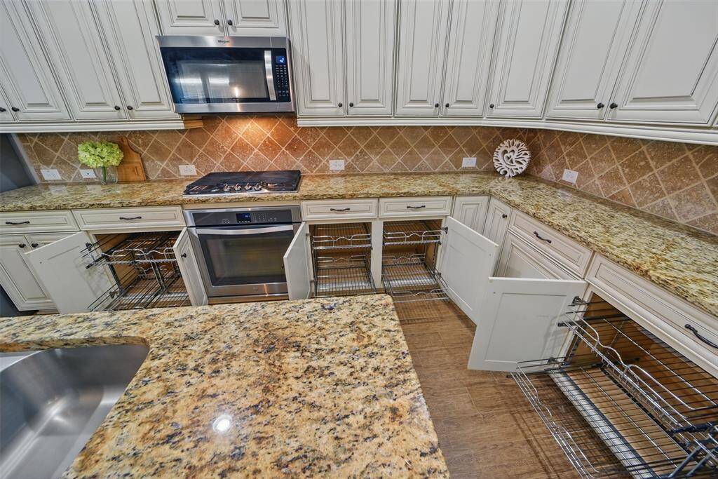 All of the lower cabinets have pull out shelving! Such a functional homeowner upgrade!
