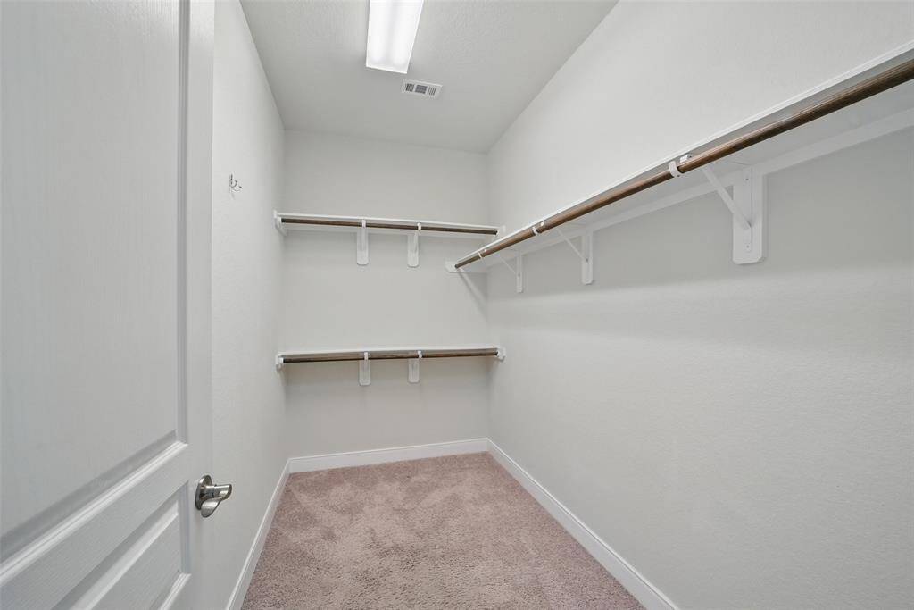 ONE of TWO primary bedroom walk-in closets.