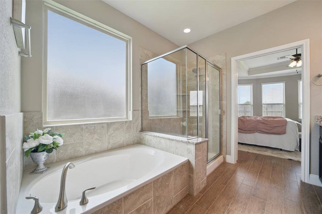 Soaking tub and large shower with bench.