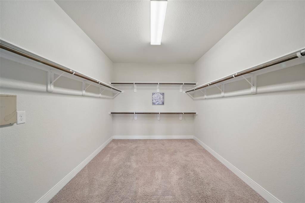 The SECOND exceptionally large walk in closet for the primary bedroom.