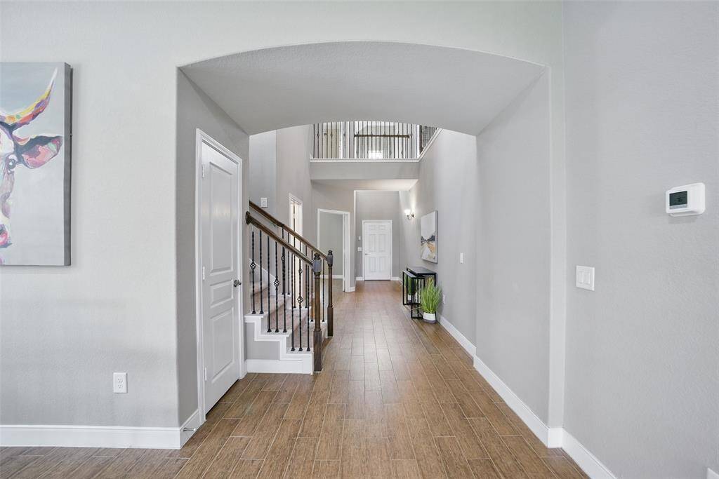 Next to the stair way is deep hall closet.