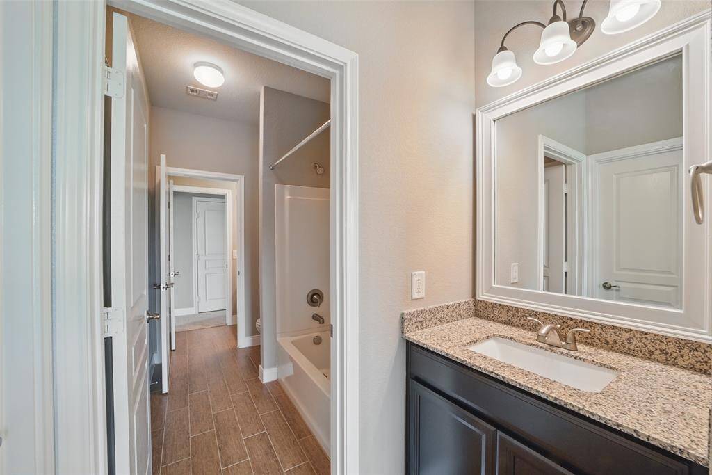 3rd bedroom has hollywood bath with private sin.